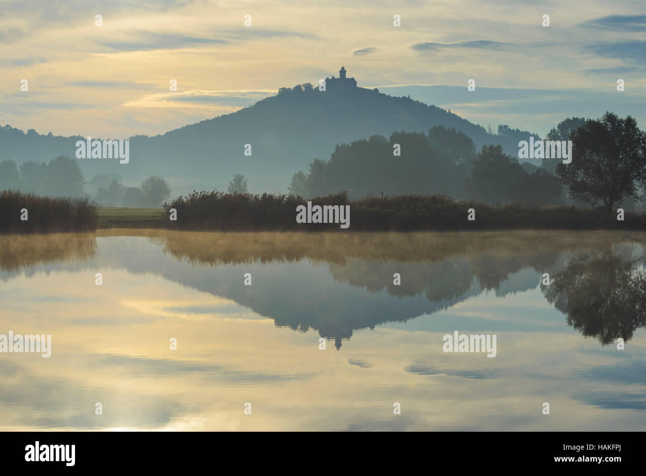 Wachsenburg Castle at Sunrise Reflecting in Lake, Drei Gleichen, Ilm District, Thuringia, Germany Stock Photo