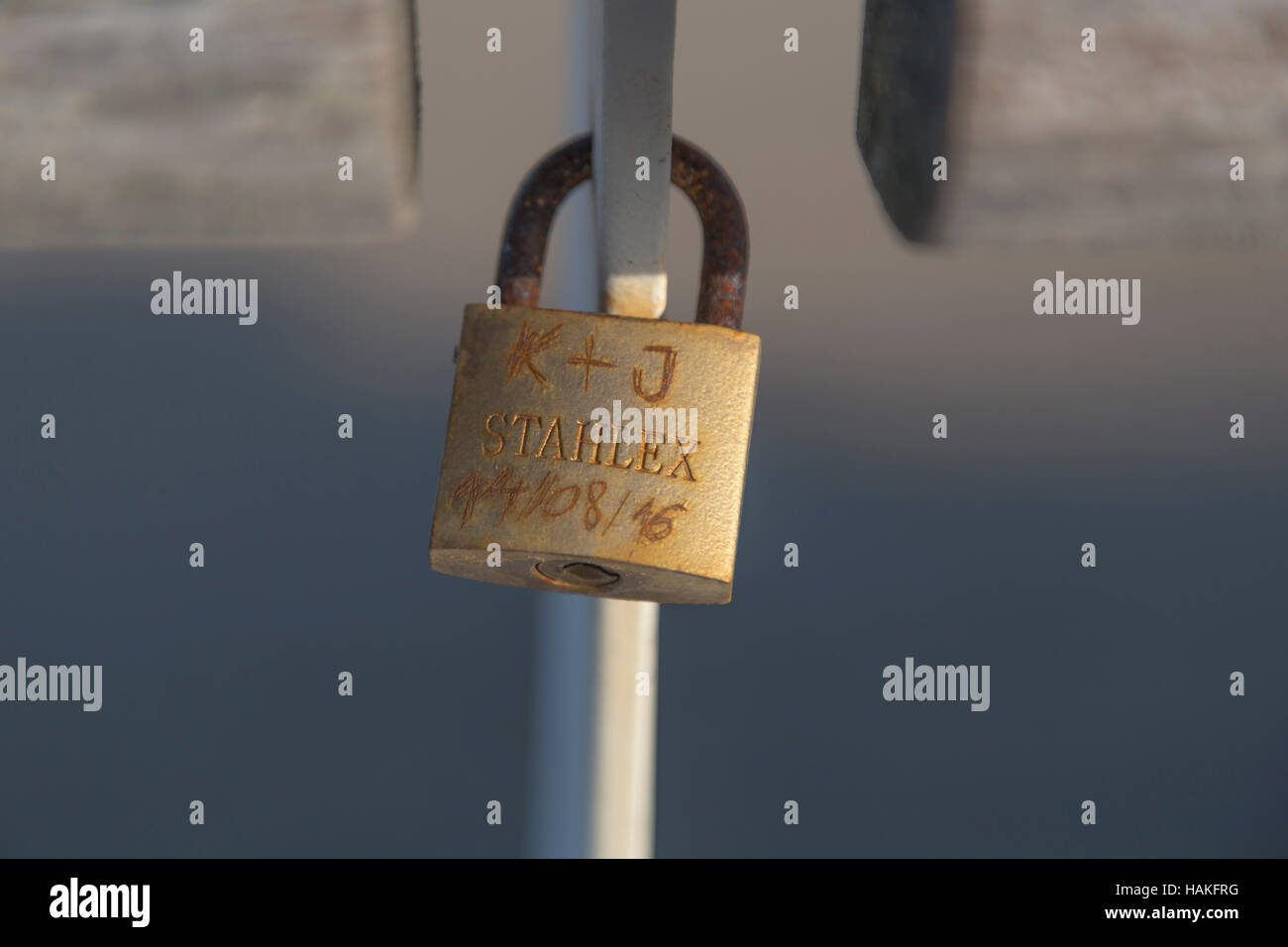 Close-up details of a love lock with inscriptions attached to a fence on the Pier, Scheveningen, The Hague, South Holland. Stock Photo
