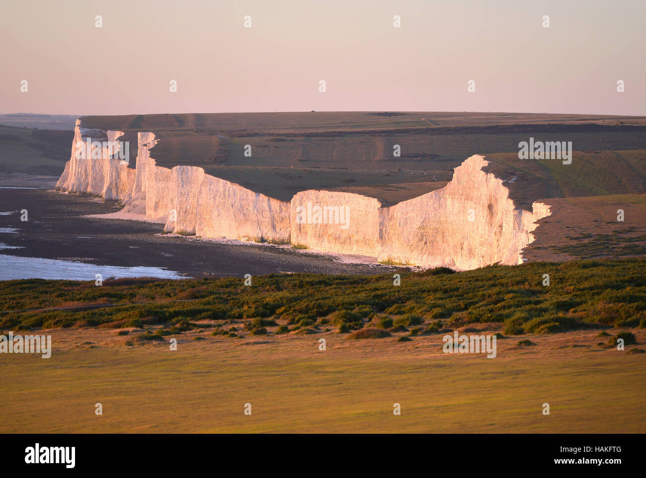 Chalk cliffs of the Seven Sisters where the South Downs meets the sea Stock Photo