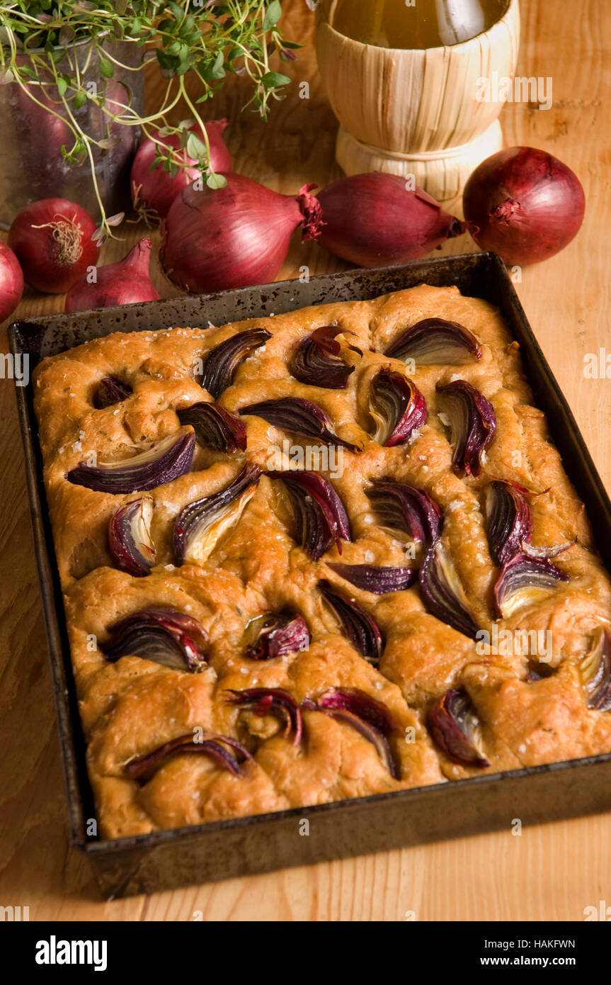 Focaccia bread with olive oil and red onions. a UK Italian bread bake baked Stock Photo