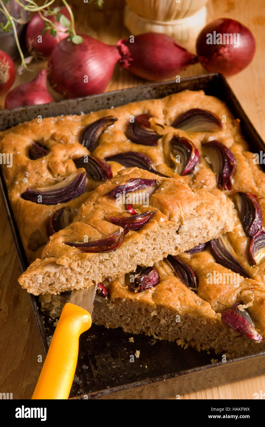 Focaccia bread with olive oil and red onions. a UK Italian bread bake baked Stock Photo