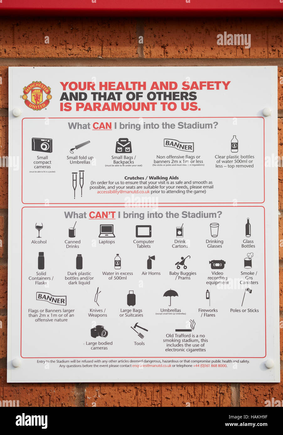 Manchester United Sir warning notice   MUFC stadium Old Trafford football club health safety notice bring in can't banned items articles sign displaye Stock Photo