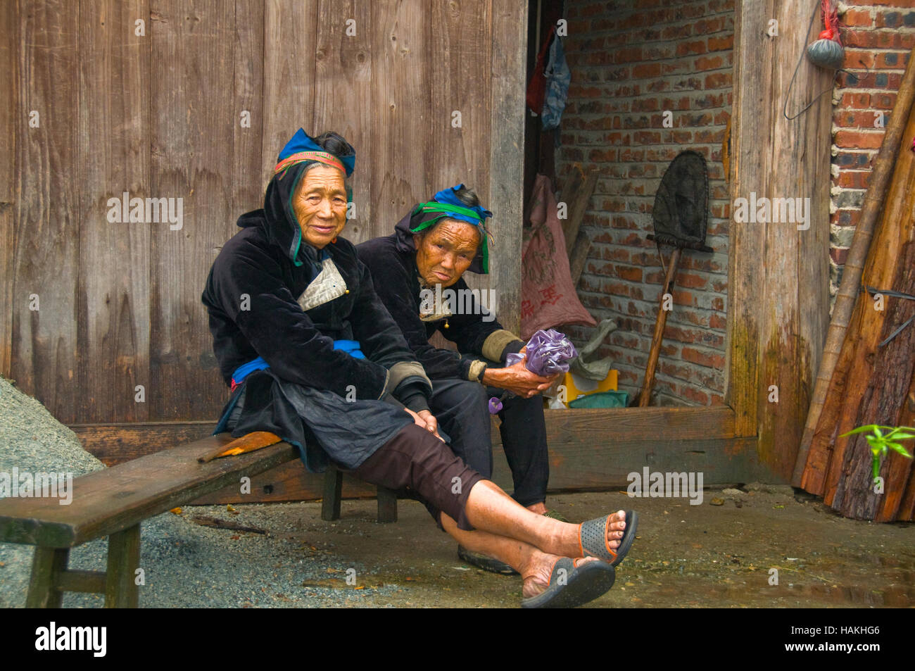 Two of the ladies of the Kam Dong Village in Guizhou Province of China chat. Stock Photo