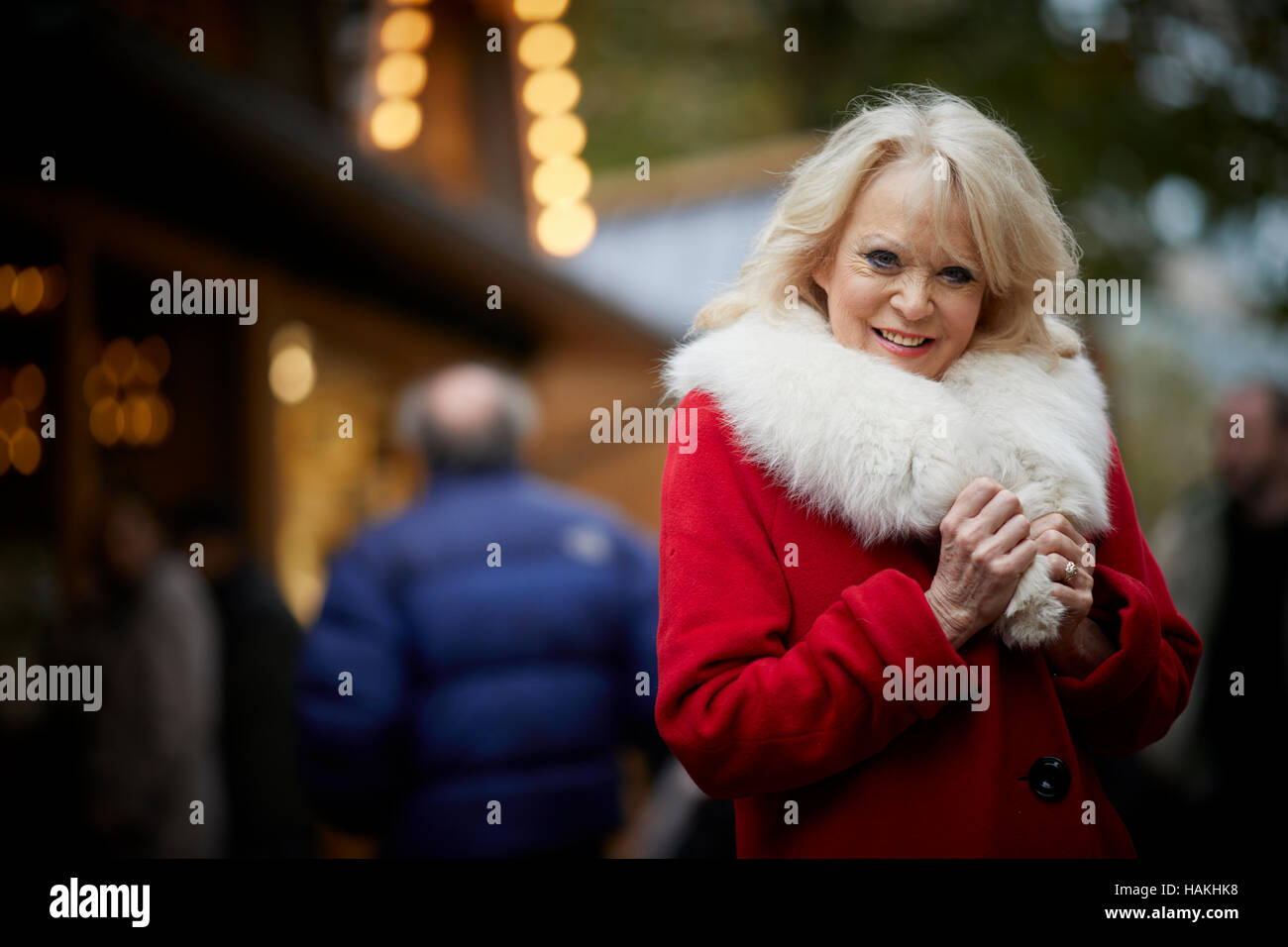 Born in Nottingham Sherrie Hewson posed portraits wearing a red santa style coat Stock Photo