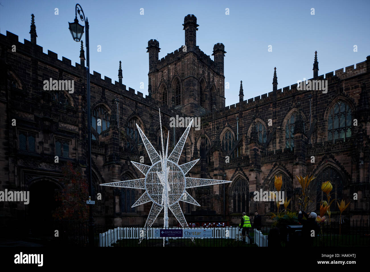 Chester Cathedral neon star large   exterior Christmas xmas festive seasonal market stalls gift  Market bazaar vendor trader traders independent shops Stock Photo