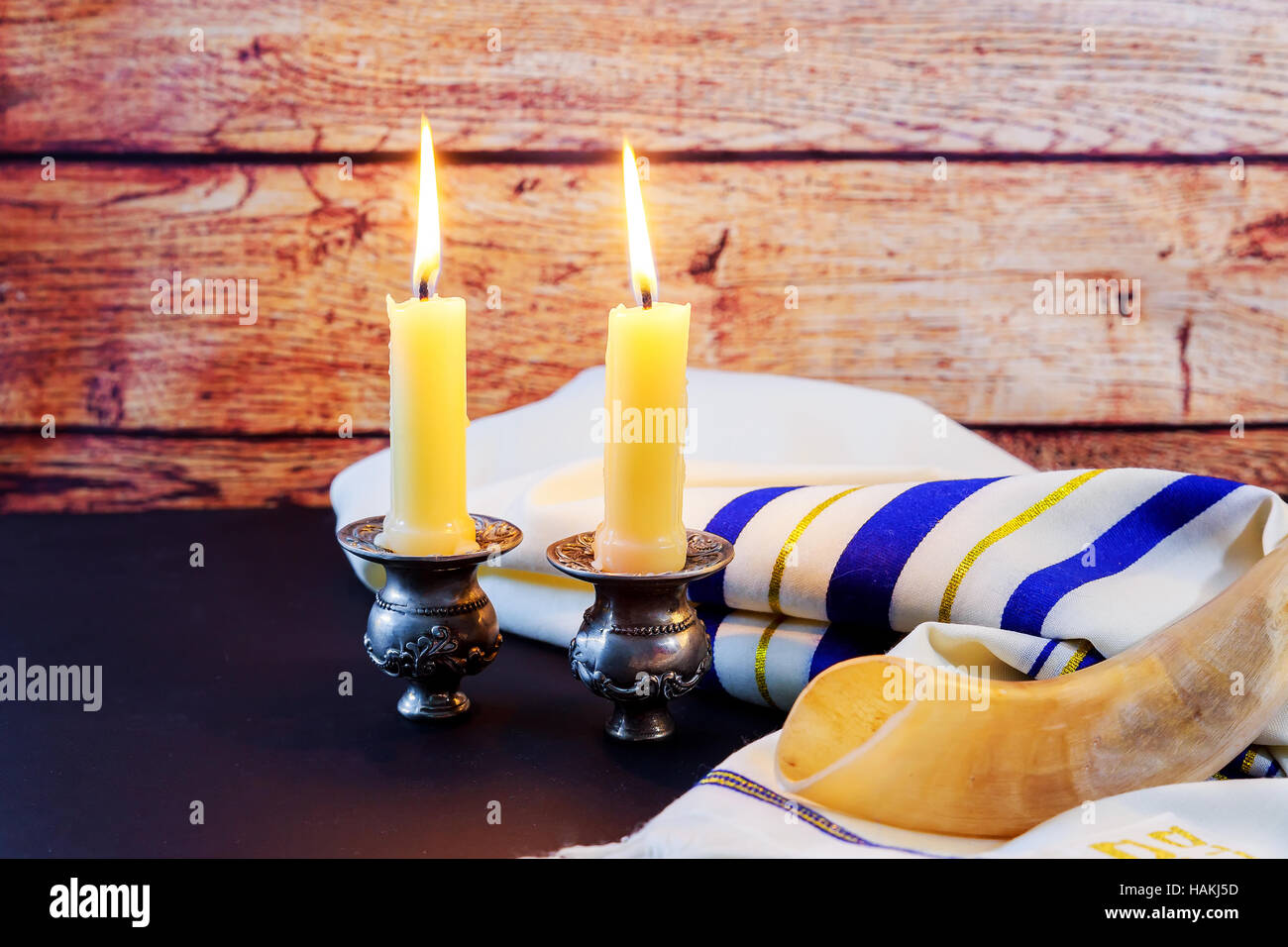 Shabbat candles in glass Jewish holiday Sabbath Prayer Shawl Tallit and