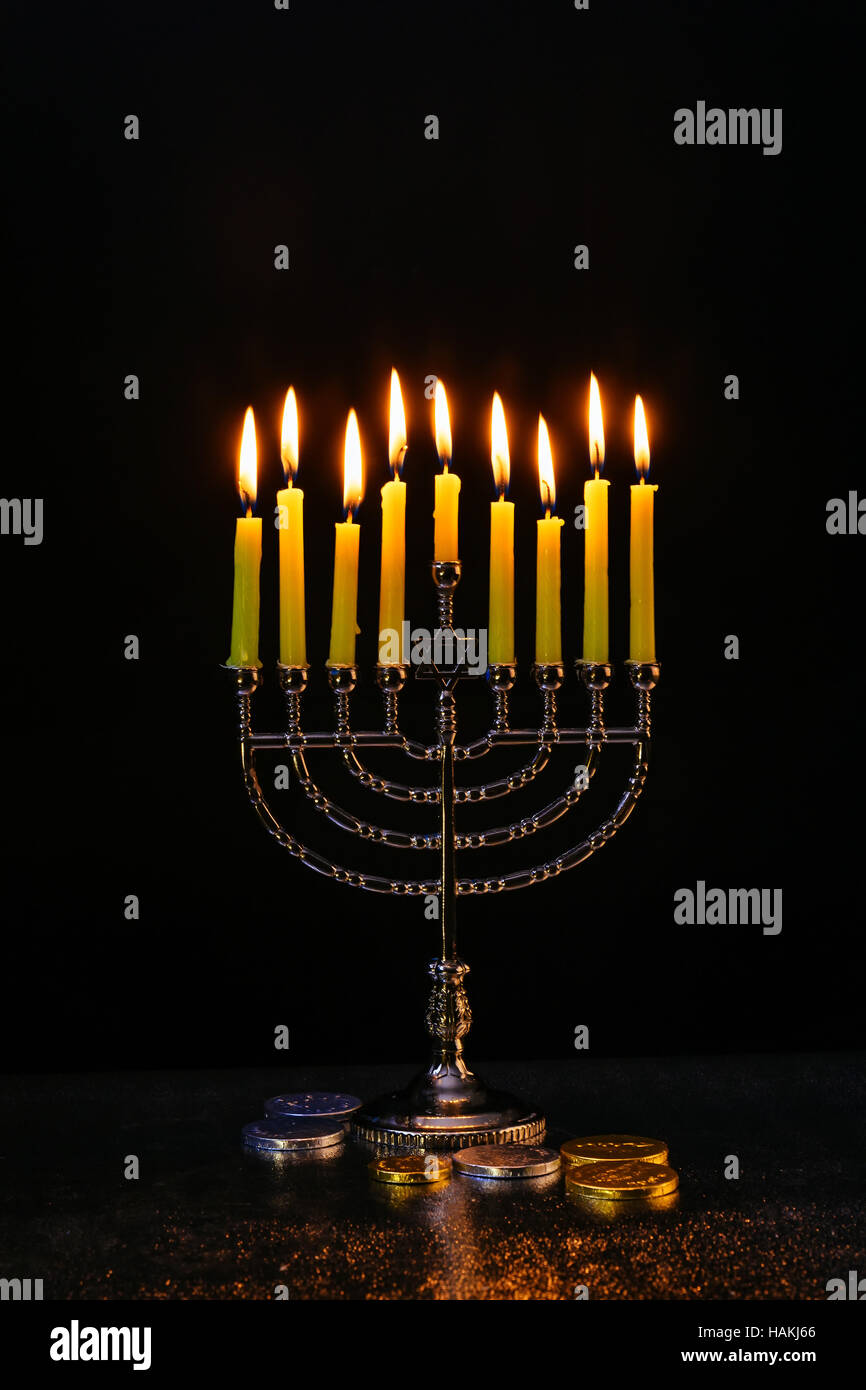 Jewish holiday hanukkah celebration with vintage menorah tallit Stock Photo