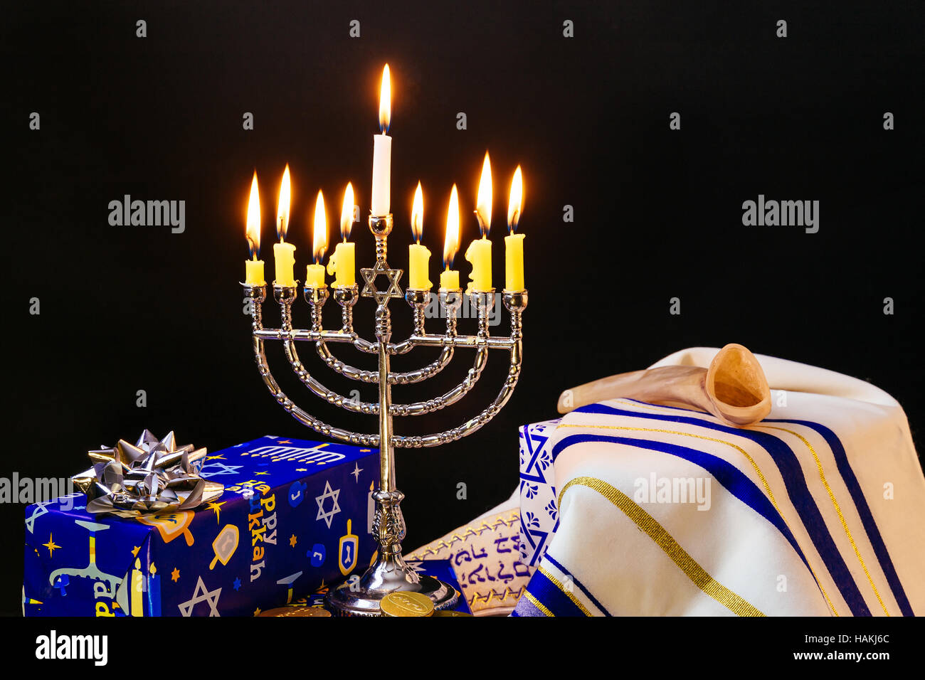 Jewish holiday hanukkah celebration with vintage menorah tallit Stock Photo