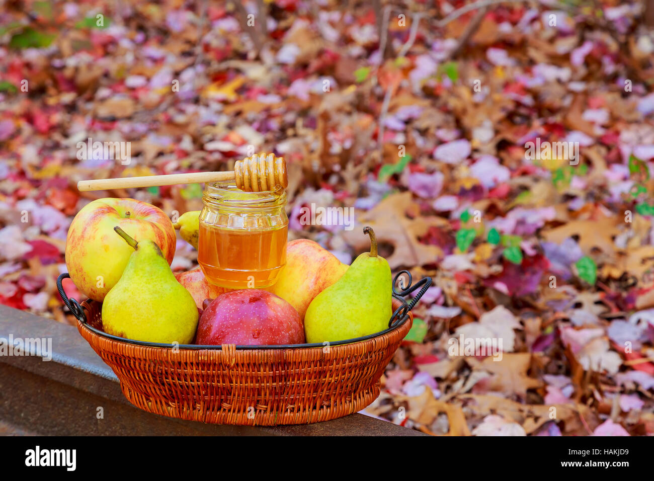 Autumn fruits, nuts and vegetables with honey on white Stock Photo