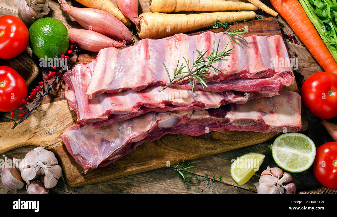 Raw fresh beef ribs with vegetables. Stock Photo