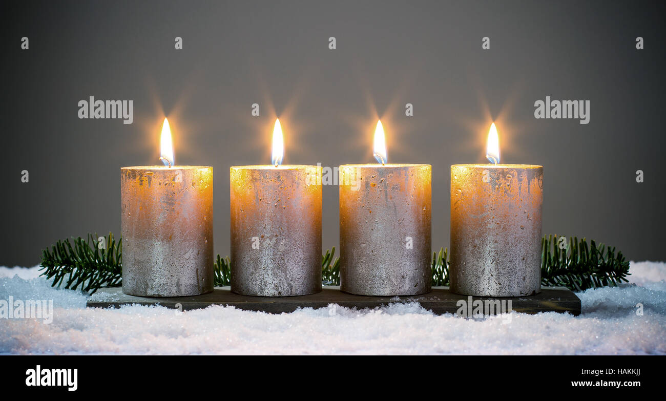 Light four advents candles with matches Stock Photo Alamy