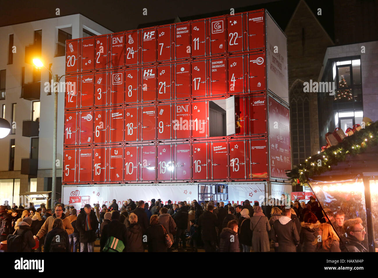 Dortmund/Germany, Dec.1th 2016. The first door has been  opened at the supposedly largest Advent calendar of the world. Made of 30 ship containers the Advent calendar is 15 x 13 meters in size and has a total weight of 64 tonnes. Behind the first door was a voucher for the furnishing of a children's home in Dortmund. From December 1th onwards, a Christmas child will open a door every day at 18:00 from above a lifter. Stock Photo