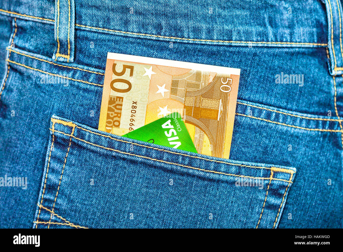 Banknote 50 euro and credit card Visa in back jeans pocket Stock Photo -  Alamy