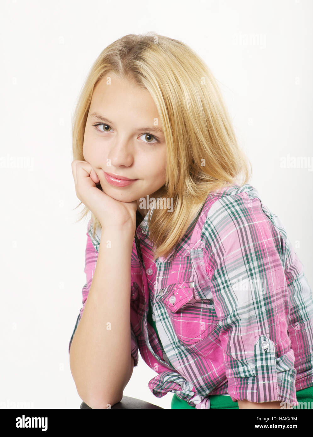 Cute young blond teen girl in studio Stock Photo - Alamy