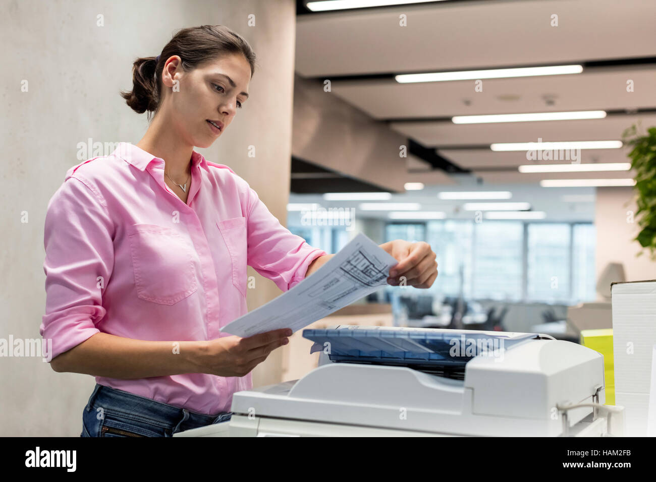 People using photocopier hi-res stock photography and images - Alamy
