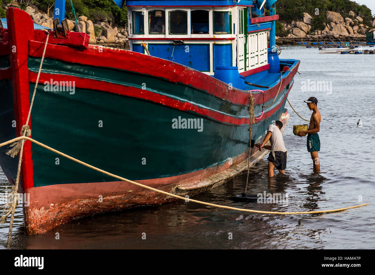 Fisherman painting boat hi-res stock photography and images - Alamy