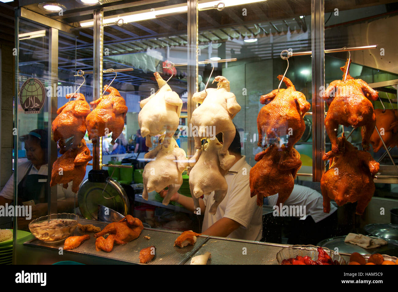SINGAPORE - JULY 23rd, 2016: duck grilled or roasted hanging in cupboard-glass at Lau Pa Sat Festival Market Stock Photo