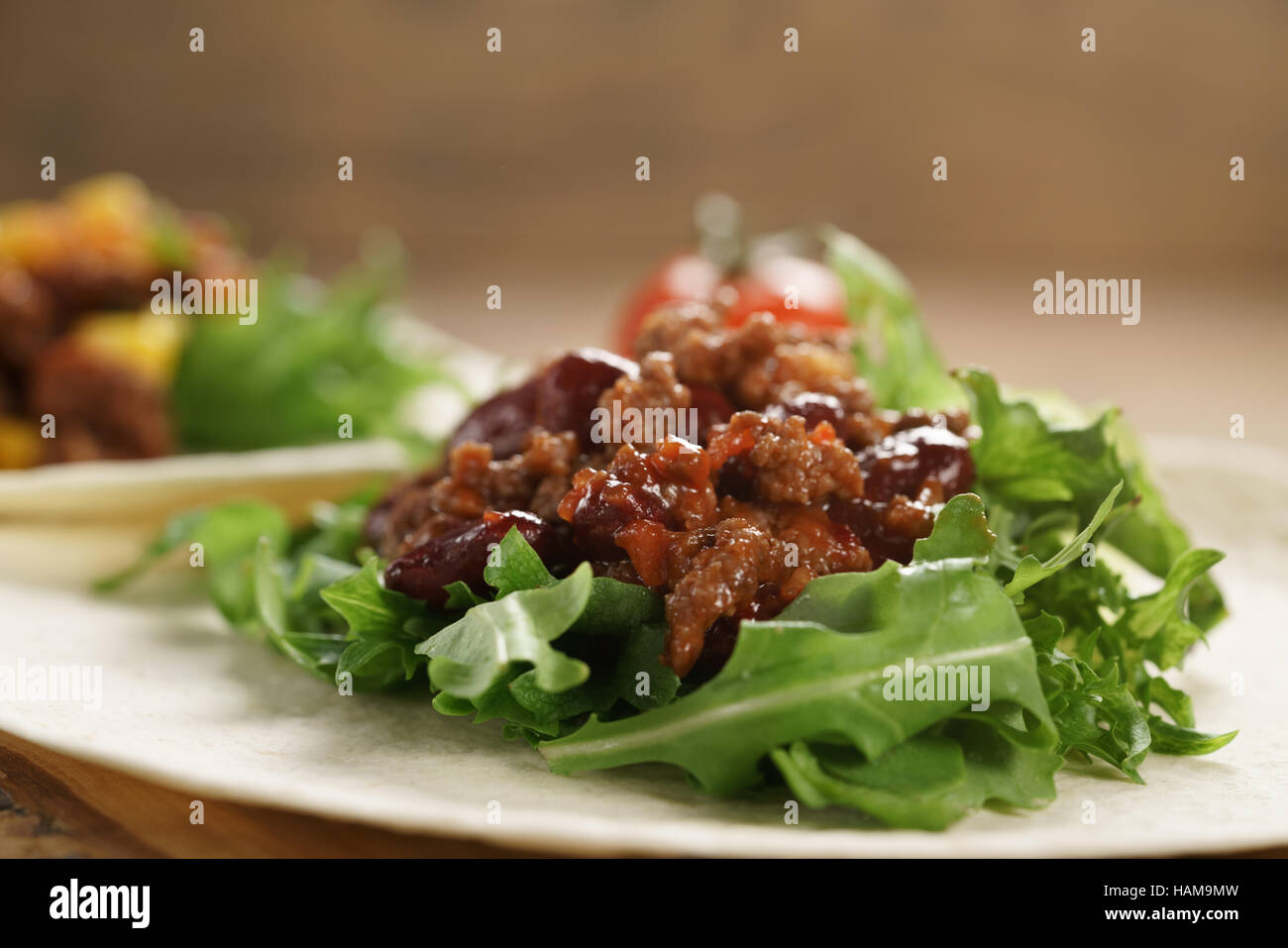 open tortilla with beef, frillice, beans and corn Stock Photo