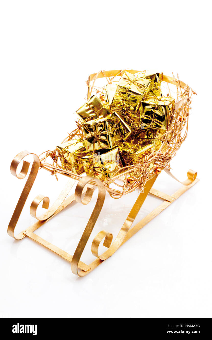 Golden sleigh with presents Stock Photo - Alamy