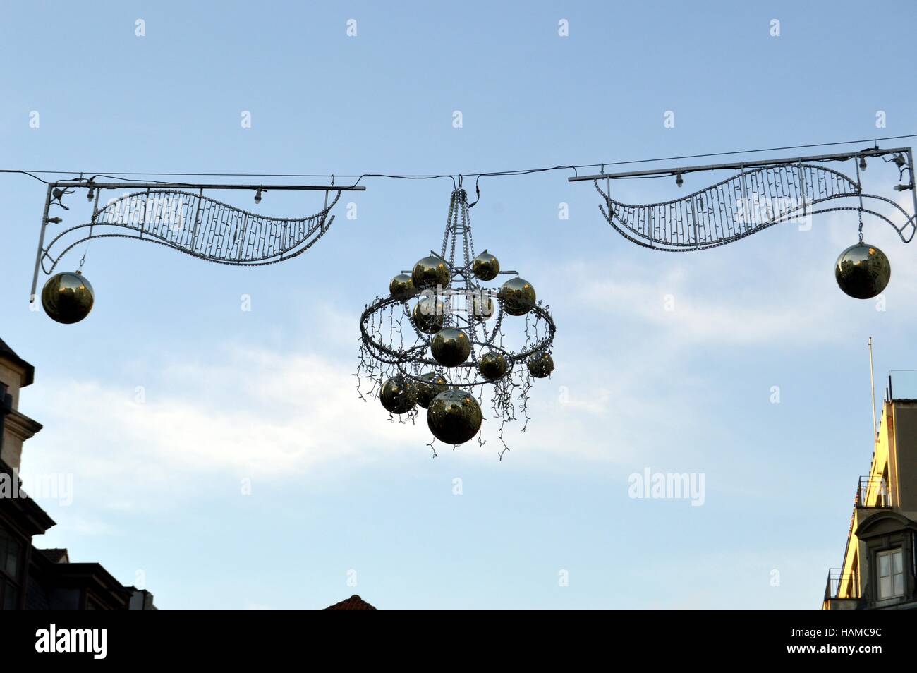 Outdoor christmas decoration hanging has a cable with gray balls Stock Photo