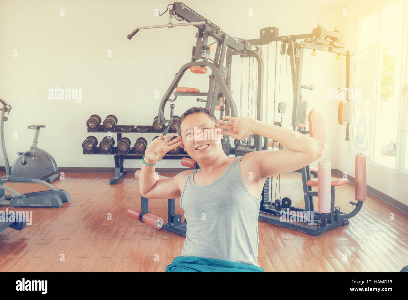 Asia man middle aged sit up in the gym for strength, weight loss. Stock Photo