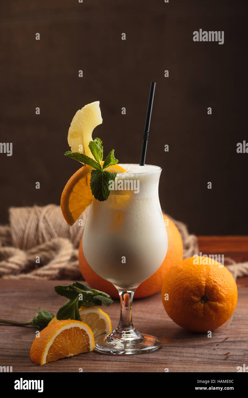 Concept: restaurant menus, healthy eating, homemade, gourmands, gluttony. Milk shake with ingredients and vintage cutlery on wooden background. Stock Photo