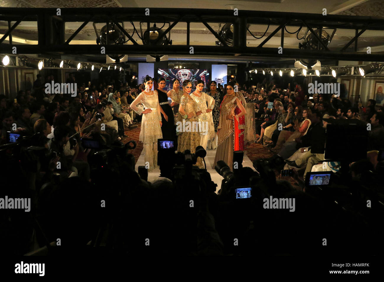 Lahore. 1st Dec, 2016. Models present creations of designer Nazish