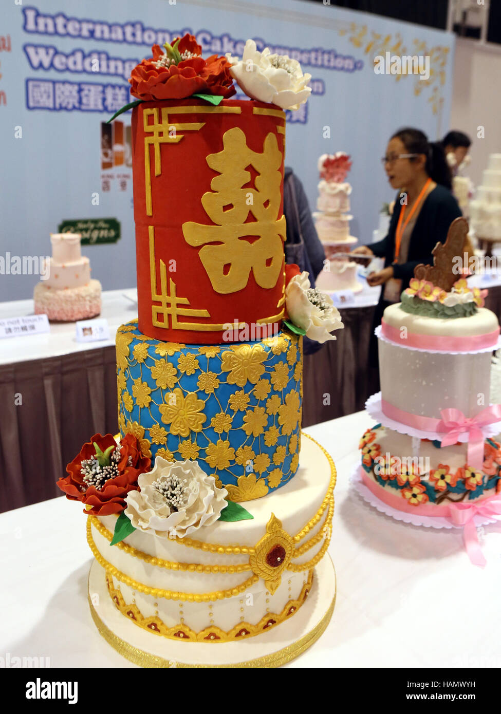 Hong Kong, China. 2nd Dec, 2016. Visitors view wedding cakes during an