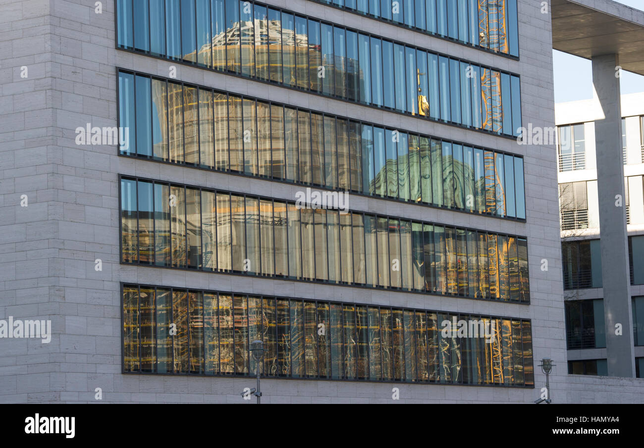 Berlin, Germany. 2nd Dec, 2016. The tower of the City Palace and of the cathedral (R) reflect in the glass facade of the Foreign Ministry in Berlin, Germany, 2 December 2016. The Ethnologic Museum and the Museum for Asian Arts will be closed from the 9 January 2017 in order to prepare for the move to the Berlin Palace in 2019. Photo: Paul Zinken/dpa/Alamy Live News Stock Photo
