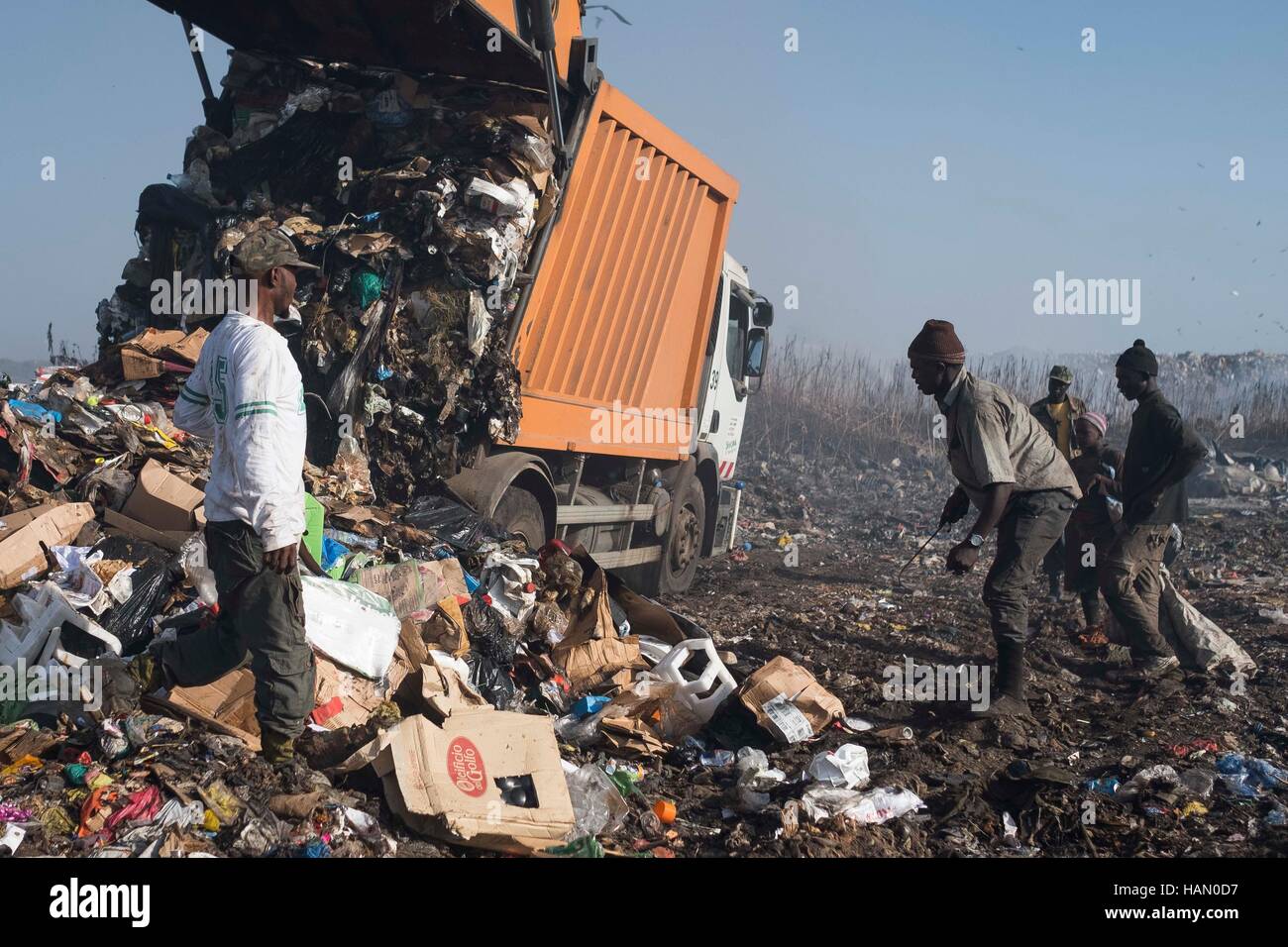 DAKAR, SENEGAL - DECEMBER 2: Men work at the Mbeubeuss landfill at the