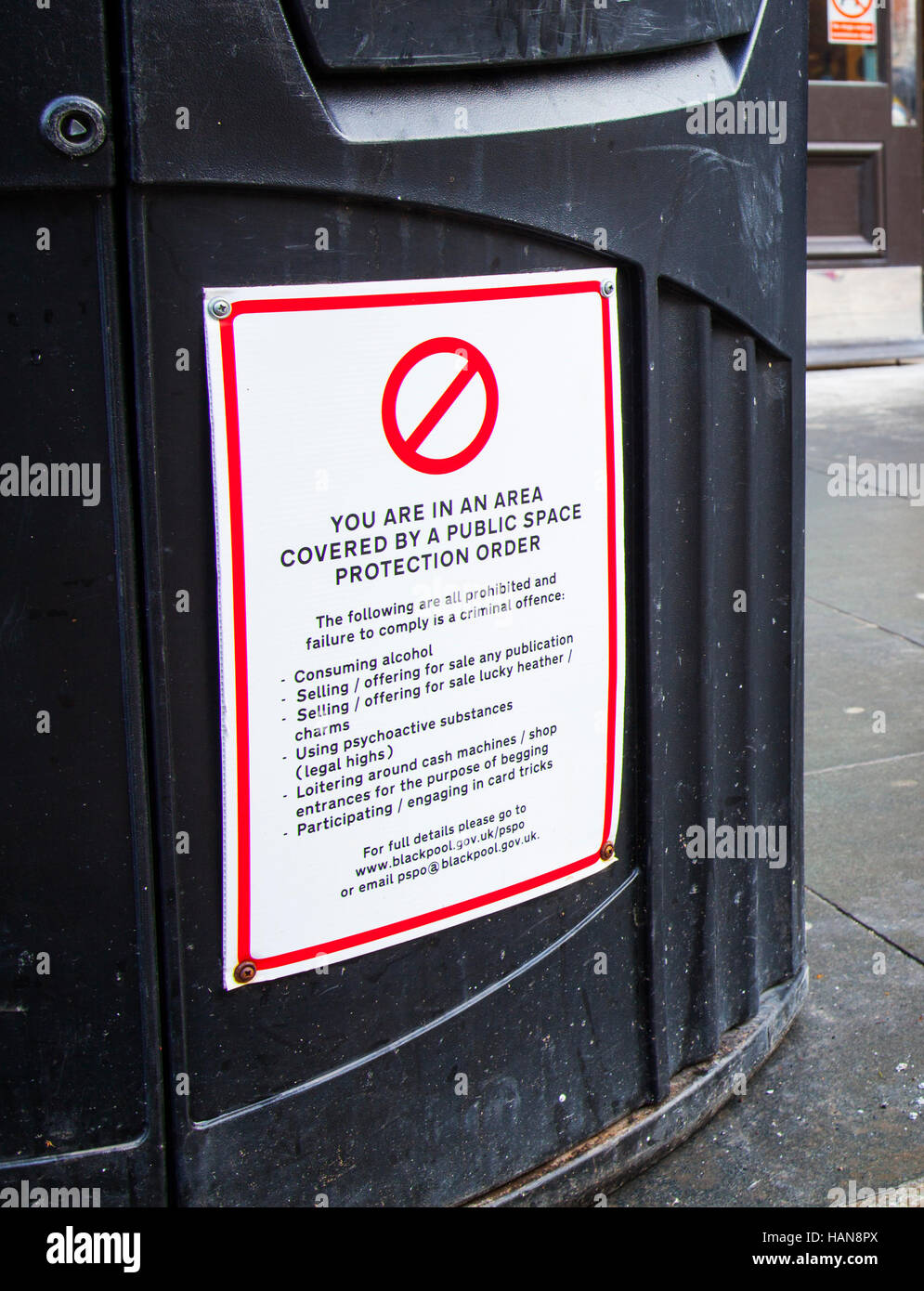 An area covered by a Public Space Protection Order. Sign on dustbin in  Blackpool, Lancashire, UK Stock Photo