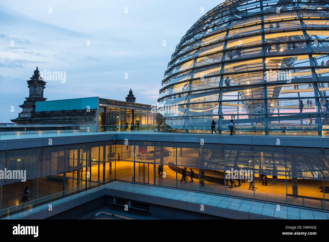 Illuminated glass dome on the roof of the Reichstag in Berlin at dusk