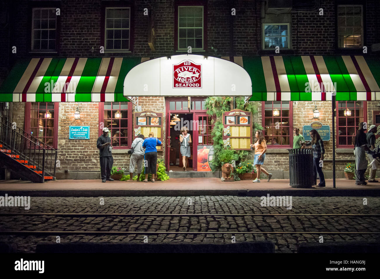 River House seafood restaurant illuminated at night in Savannah Stock Photo