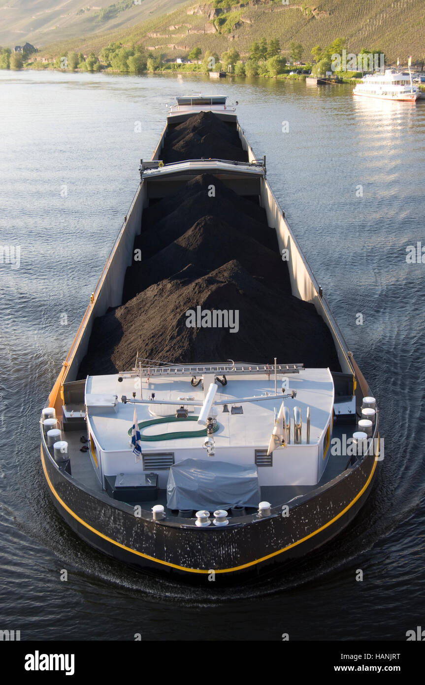 A barge carrying coal along the Moselle in Germany Stock Photo
