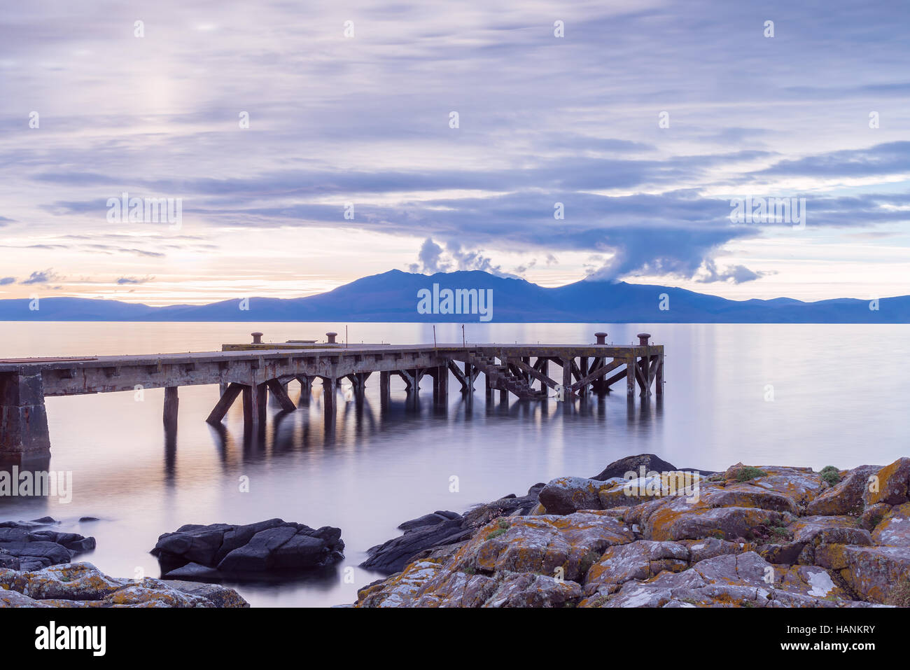 The Old Jetty or Pier at Portencross with the Arran Hills in the background. Stock Photo