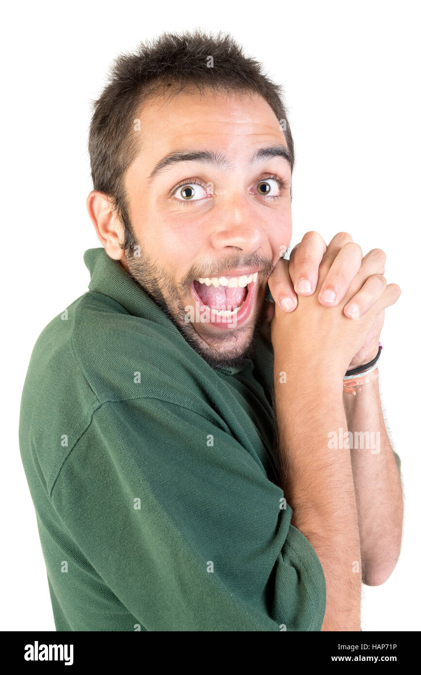 Happy young man making funny faces isolated in white Stock Photo