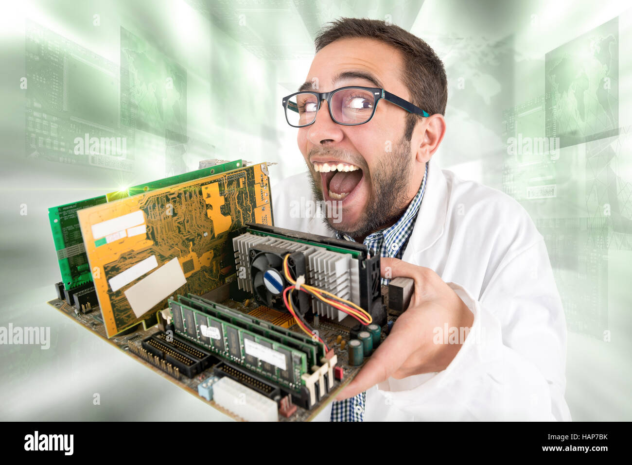 Nerd engineer posing with computer components Stock Photo