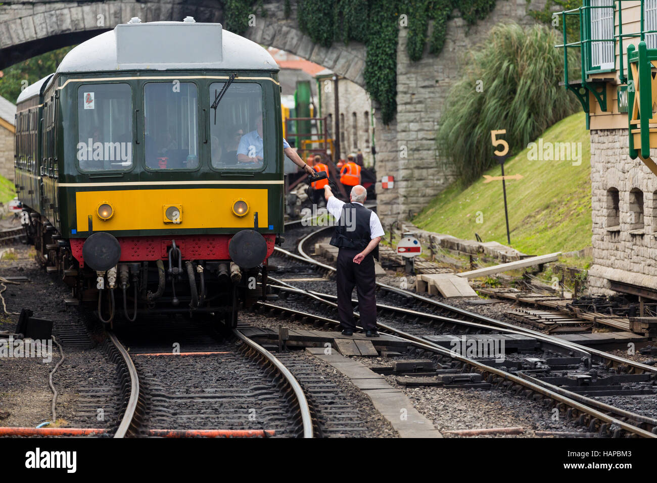 diesel unit ,Class 121 British Rail vintage locomotive ,running on the preserved Swanage railway line rural train service  arriving at Swanage station Stock Photo
