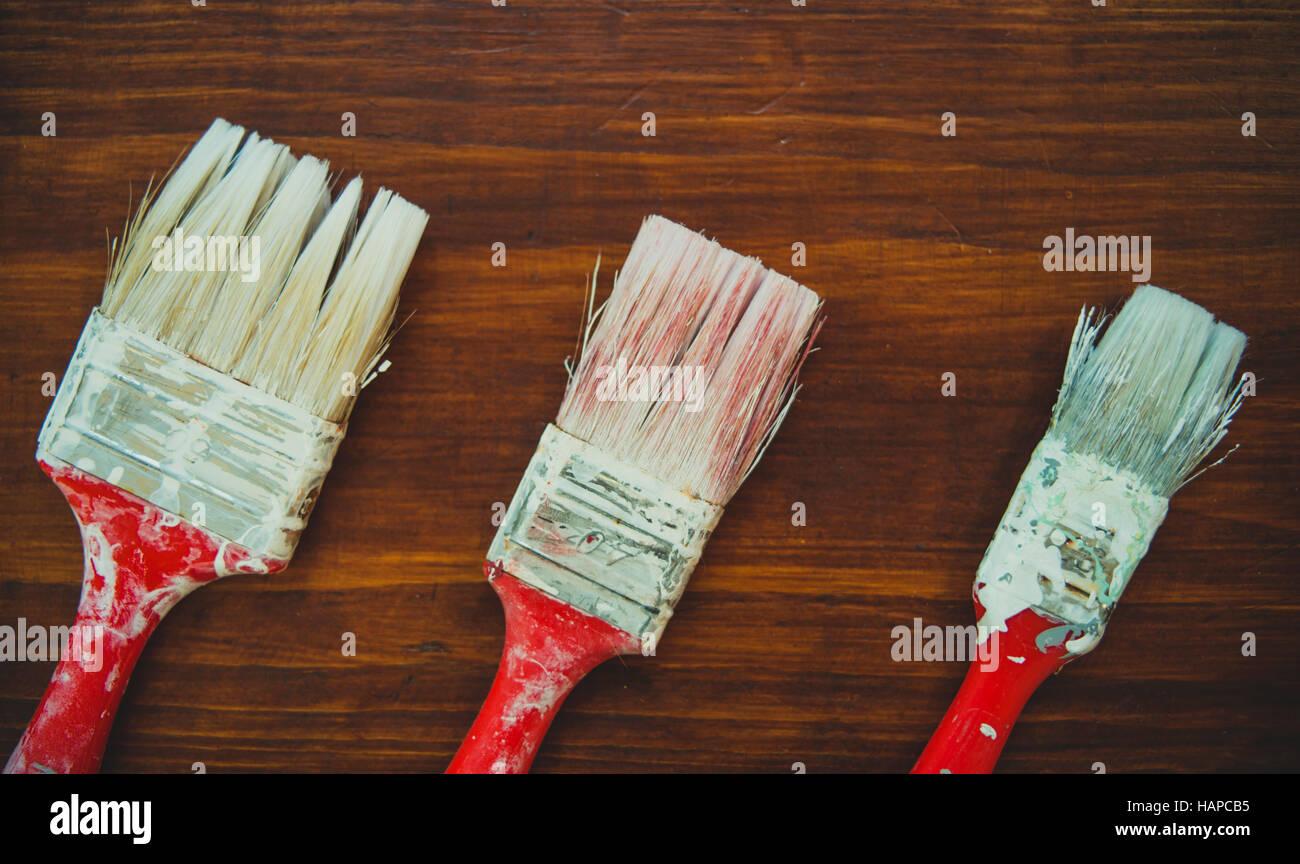 Three painting brushes on boards Stock Photo Alamy
