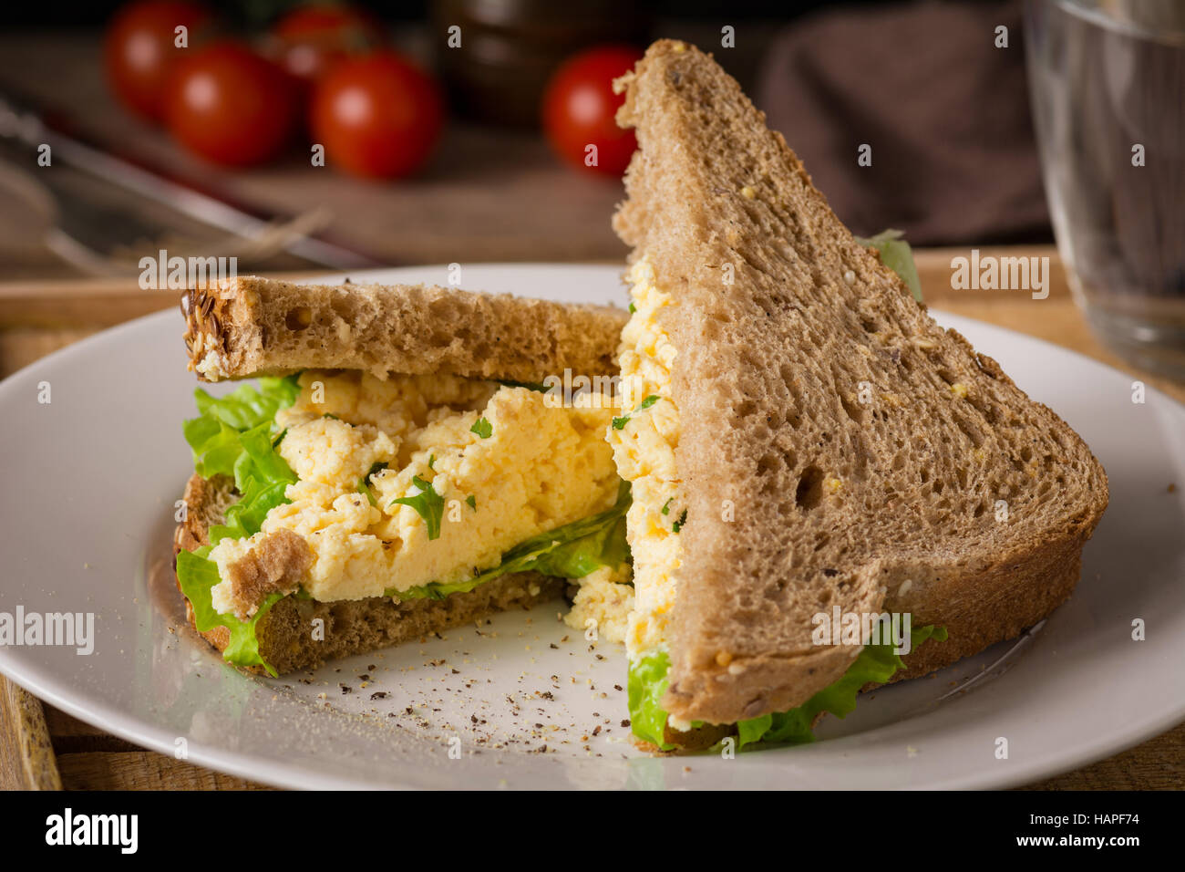 Breakfast Sandwich With Scrambled Eggs Fresh Green Salad And Whole Wheat Bread Close Up View Horizontal Stock Photo Alamy
