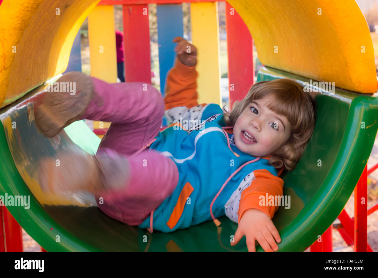 Little Girl Playing At Playground Stock Photo - Alamy