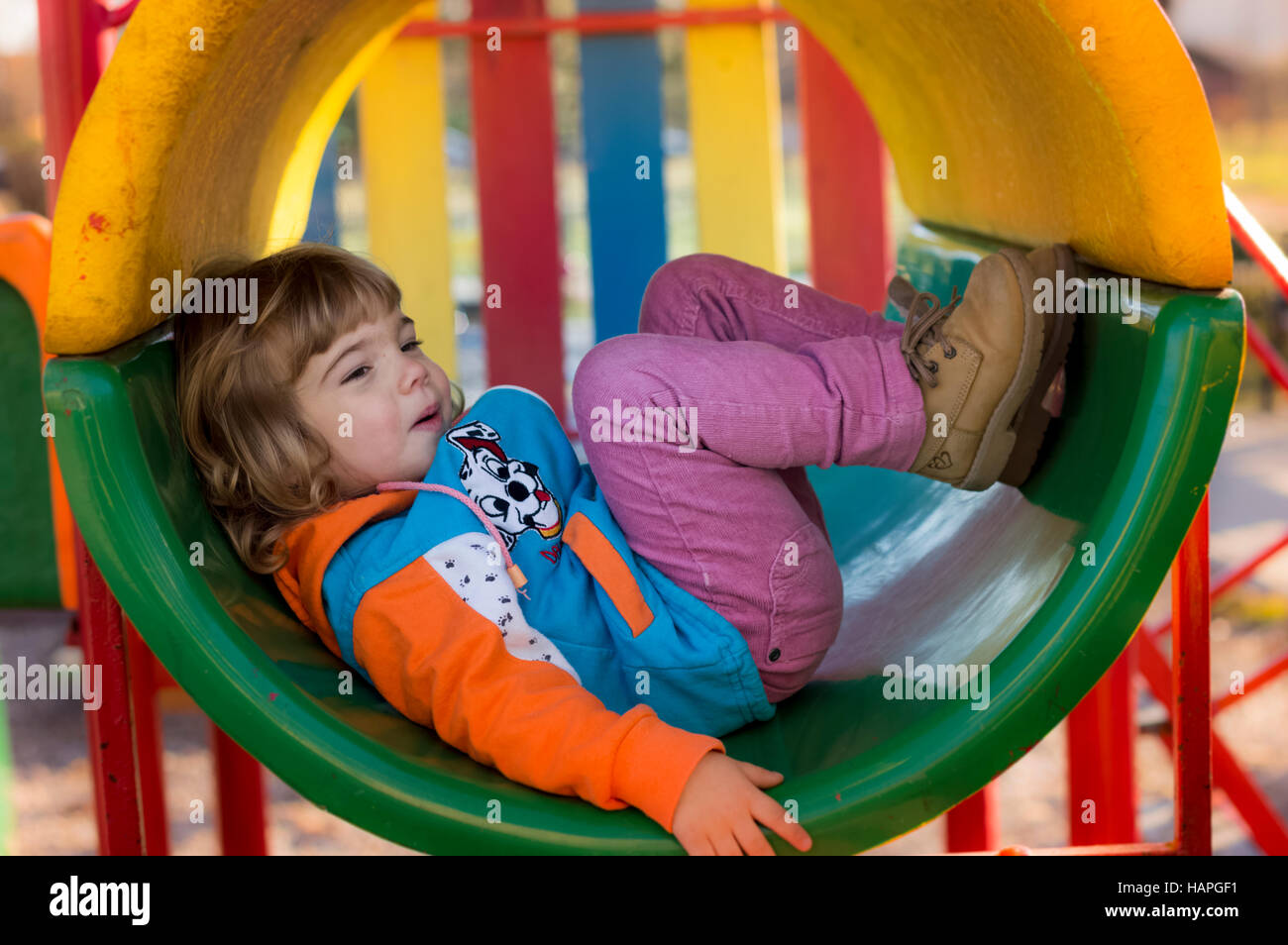 Little Girl Playing At Playground Stock Photo - Alamy