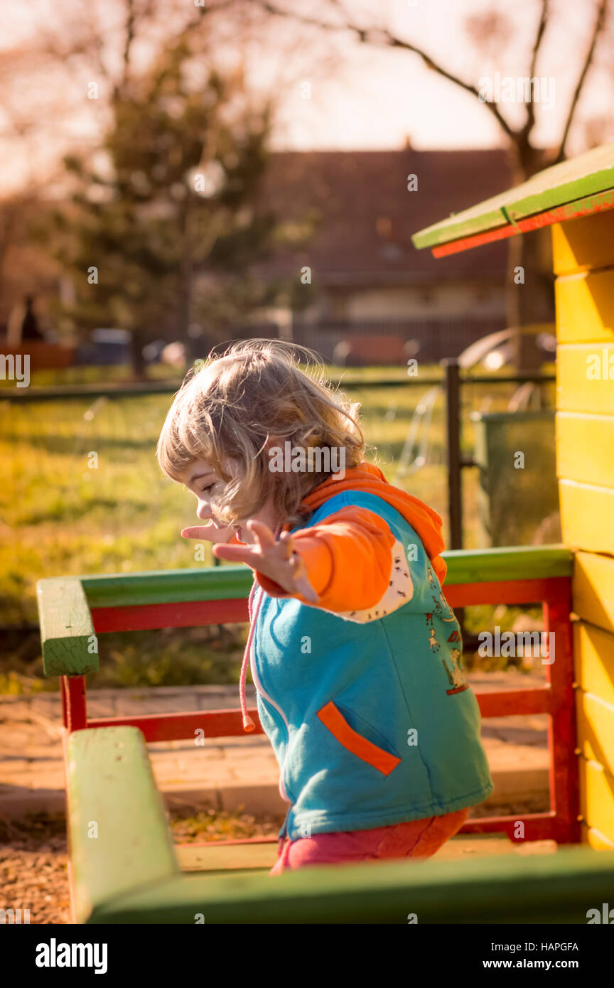 Little Girl Playing At Playground Stock Photo - Alamy