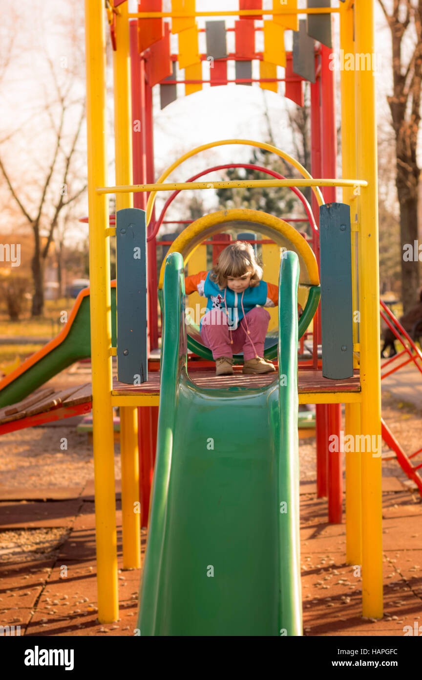 Little Girl Playing At Playground Stock Photo - Alamy
