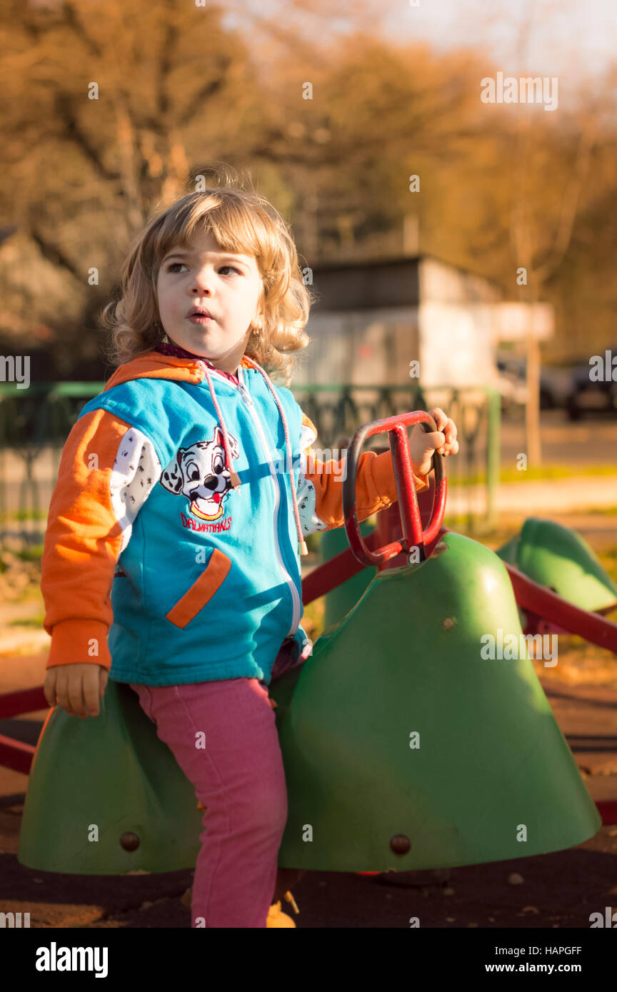 Little Girl Playing At Playground Stock Photo - Alamy