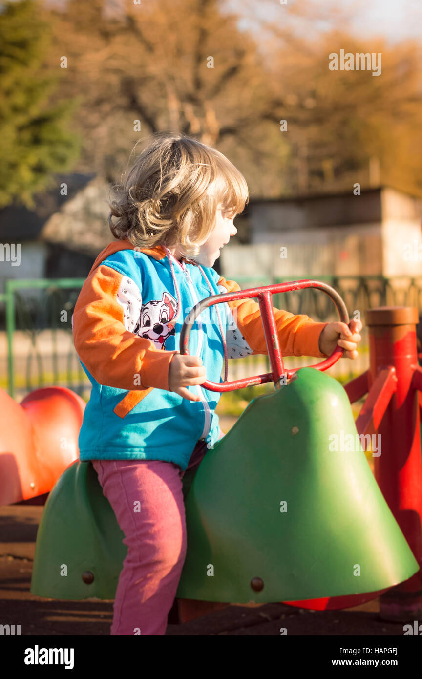 Little Girl Playing At Playground Stock Photo - Alamy