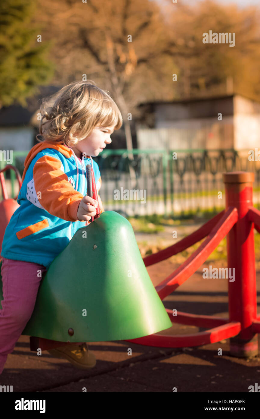 Little Girl Playing At Playground Stock Photo - Alamy
