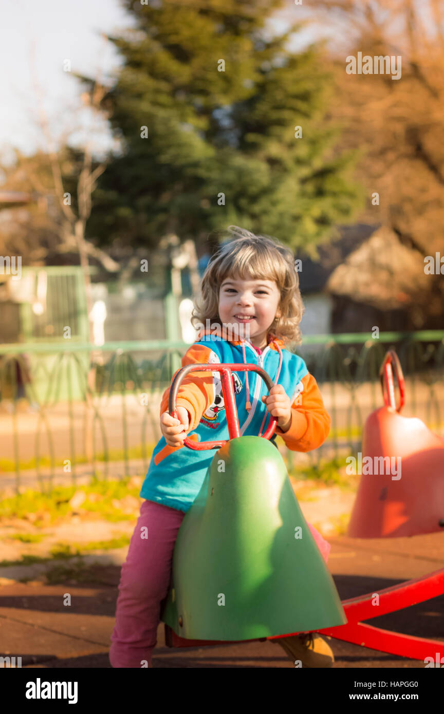 Little Girl Playing At Playground Stock Photo - Alamy