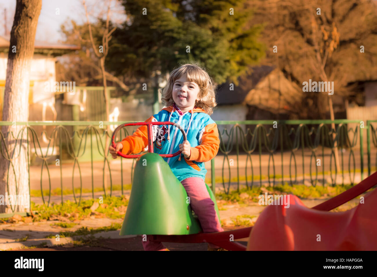 Little Girl Playing At Playground Stock Photo - Alamy