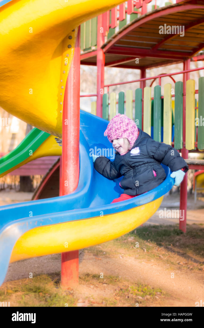 Little Girl Playing At Playground Stock Photo - Alamy